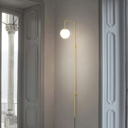 Qorven Minimalist Long Pole Globe Brass Plug In Wall Sconce