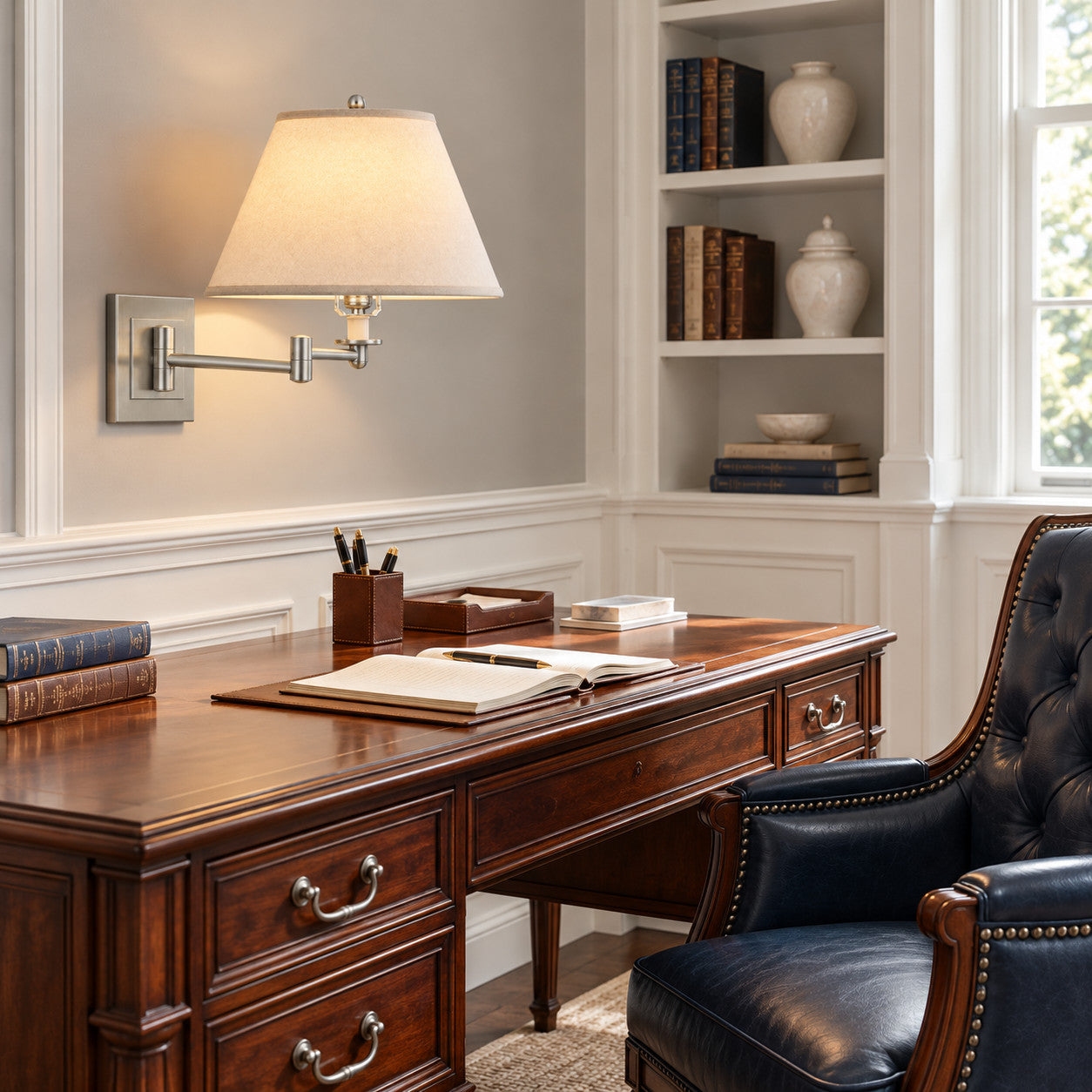 Study with a linen-shade swing-arm wall lamp