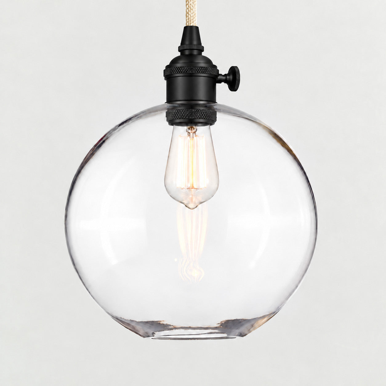 Bronze(Large) clear glass globe pendant on a plain background