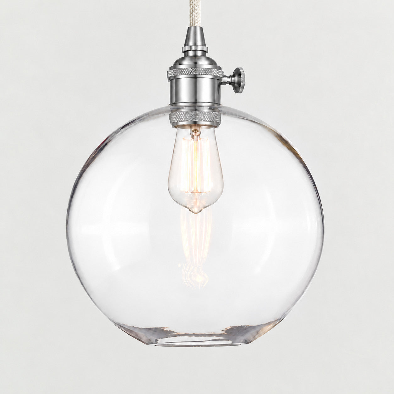 Nickel(Large) clear glass globe pendant on a plain background